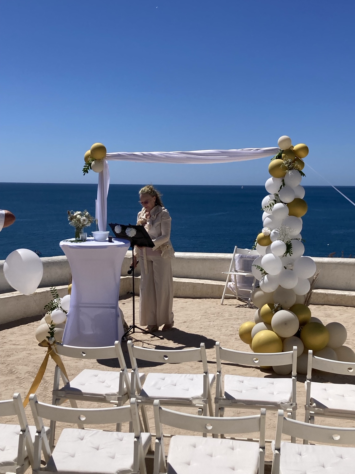 Christening ceremony setup overlooking the sea