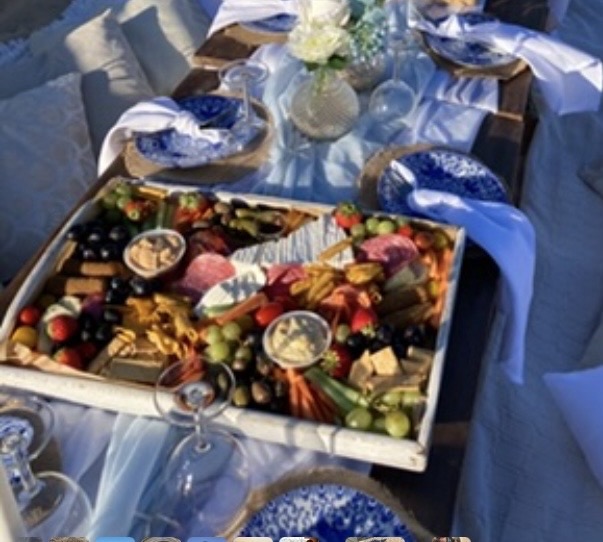 Grazing food at an outdoor table