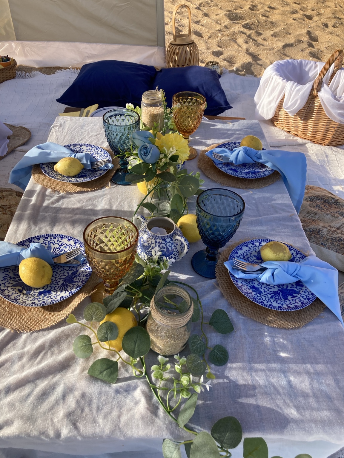 Blue and white table styled for a beach picnic
